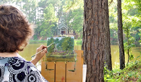 lady painting on canvas